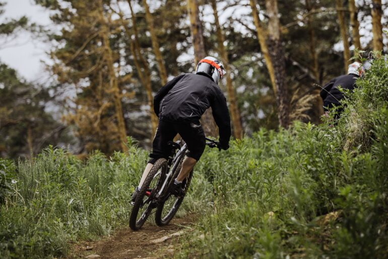 Man cycling in forest