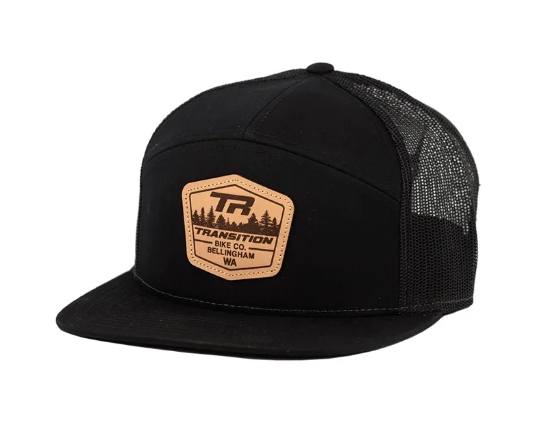 Transition 7 Panel Trucker Leather Badge Logo Cap in Black